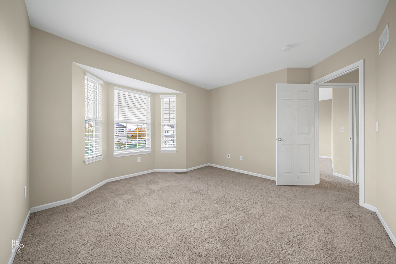 2218 Surrey Street Sycamore, IL 60178 - Photo 8 of 18 an empty room with windows