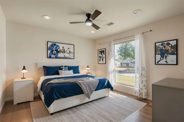 a bedroom with a large bed and a window