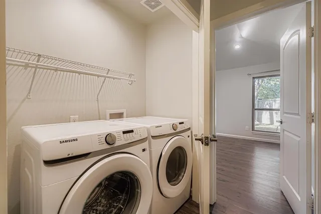 a view of a hallway with washer and dryer