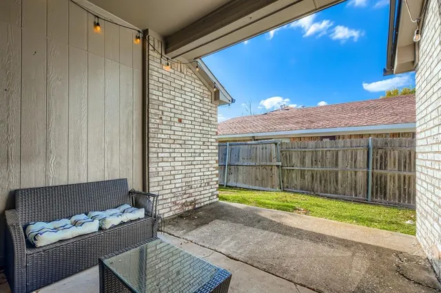 a view of backyard with tub and seating space