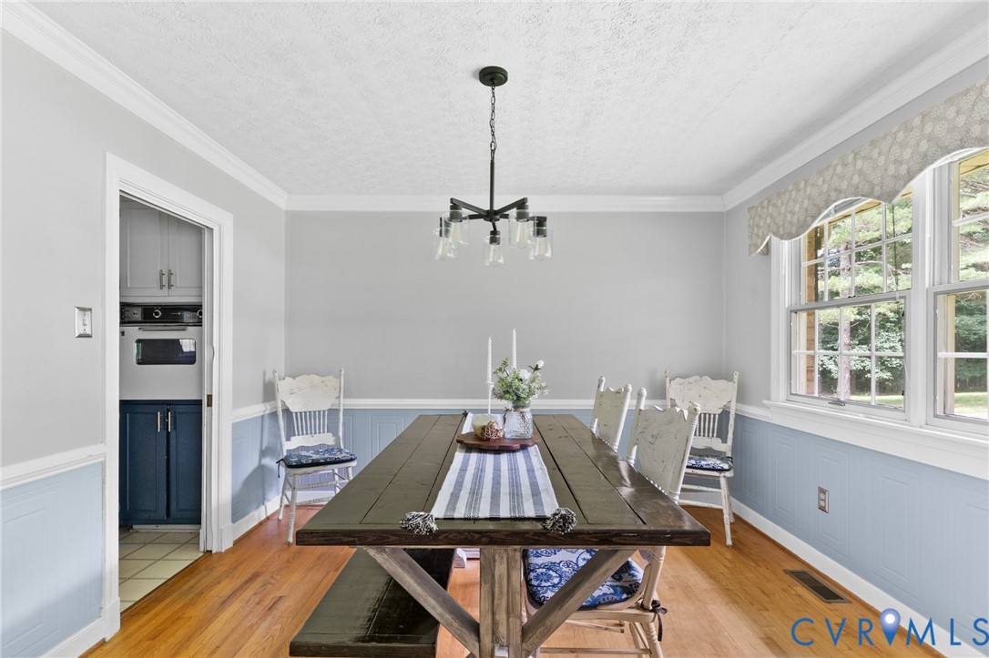 9400 Morley Road Midlothian, VA 23112 - Photo 8 of 38 Large dining room with hardwood floors, chair and