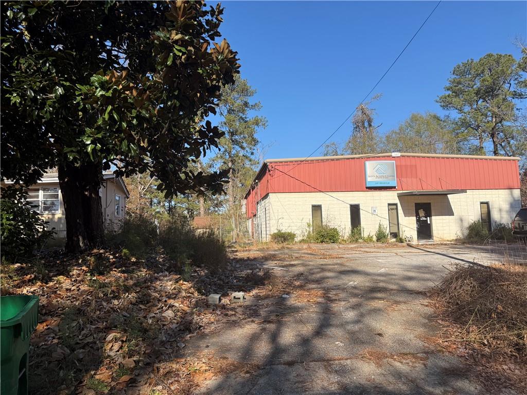 6048 Paul Road Lithonia, GA 30058 - Photo 2 of 3 a view of a house with a yard