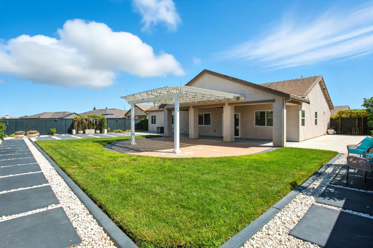 2061 Doncaster Court Olivehurst, CA 95961 - Photo 43 of 46 a front view of a house with a yard table and chairs