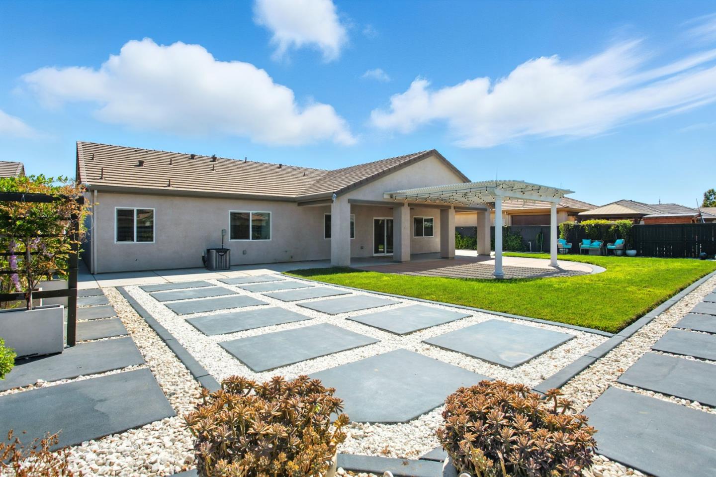 2061 Doncaster Court Olivehurst, CA 95961 - Photo 44 of 46 a view of a house with a swimming pool and a yard