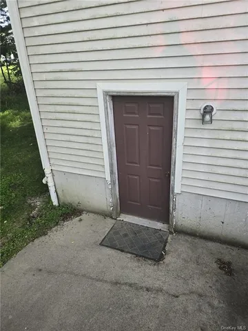 a balcony with table and chairs