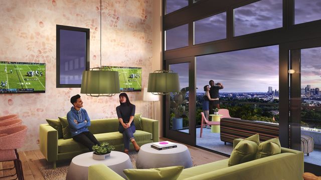 a living room with furniture and a floor to ceiling window