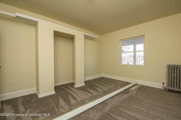 a view of a room with a window