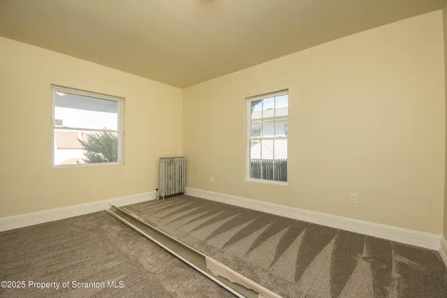 a view of a room with a window