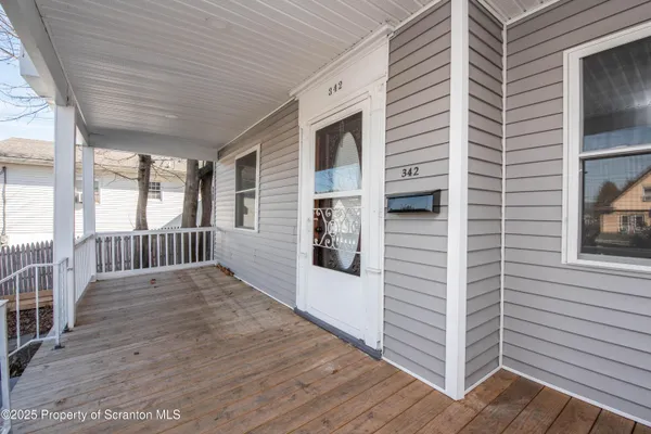 a kitchen with stainless steel appliances granite countertop a stove top oven a sink and a microwave