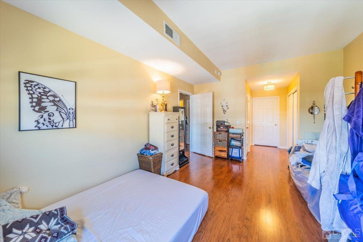 358 Rector Street, Unit 509 Perth Amboy, NJ 08861 - Photo 15 of 26 a bed room with a bed and a couch