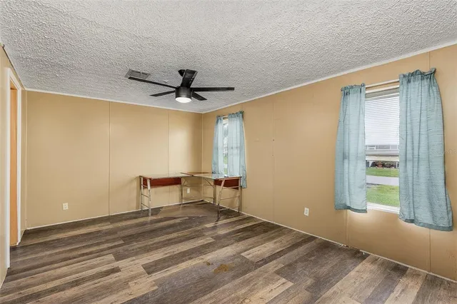 a view of room with a ceiling fan