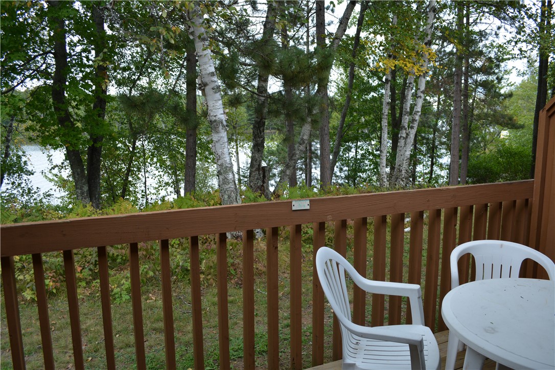 15326 Birchpoint Road, Unit 1521 Hayward, WI 54843 - Photo 9 of 53 All Units have a private deck overlooking Lake Nelson with patio furniture