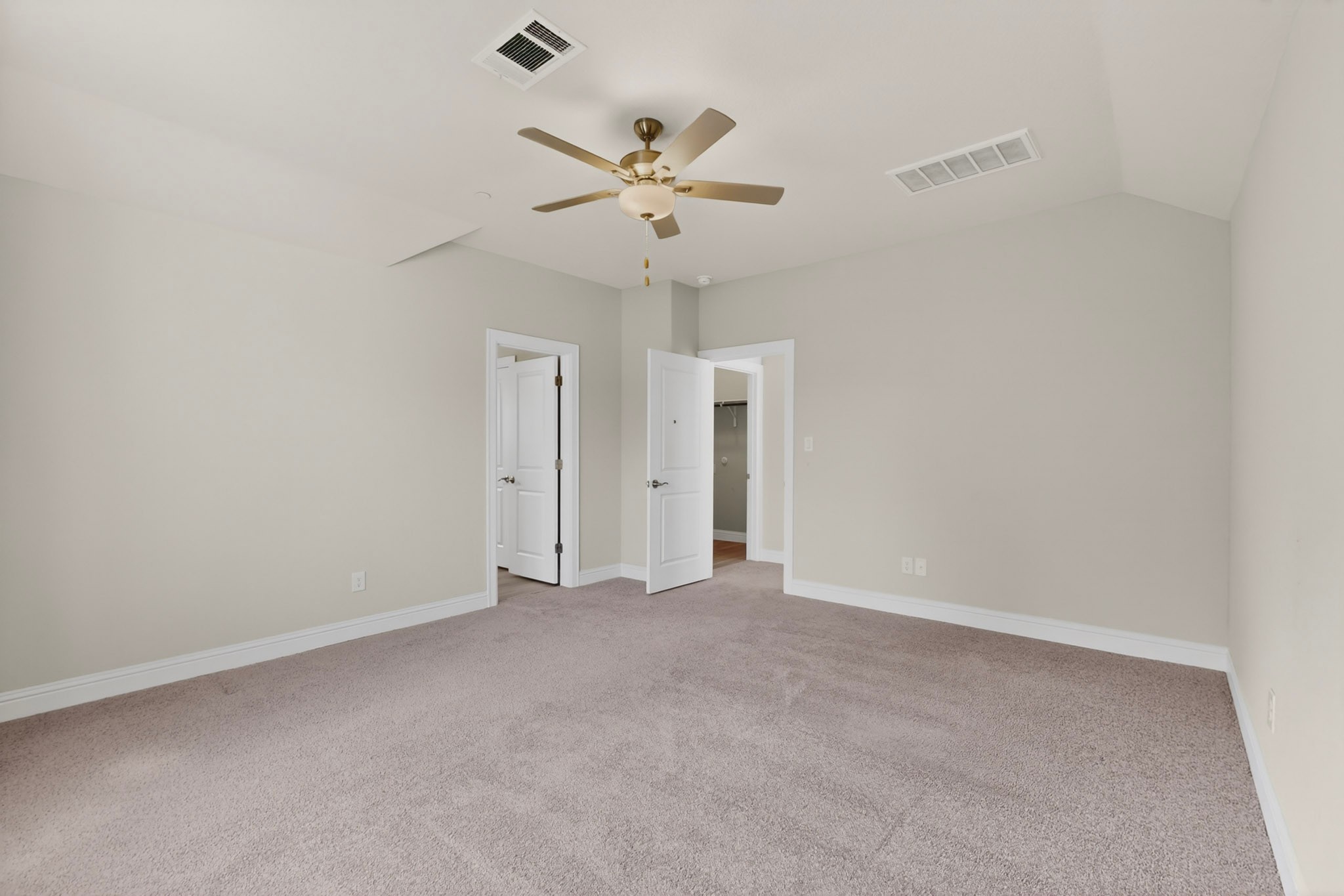 2605 Sam Bass Road, Unit 9 Round Rock, TX 78681 - Photo 24 of 38 A spacious bedroom provides comfort with soft carpeting and a ceiling fan for year-round climate control.