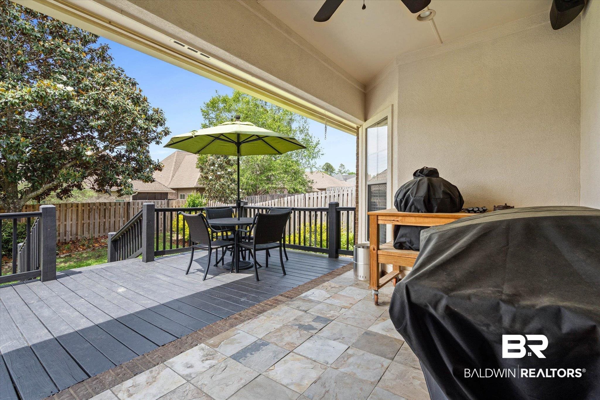3459 Rue Royal Mobile, AL 36693 - Photo 28 of 31 Covered patio featuring multi-toned stone flooring and a ceiling fan