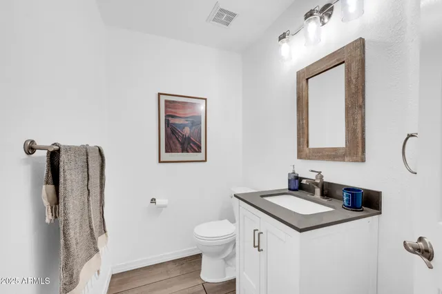 a kitchen with kitchen island a sink appliances and cabinets