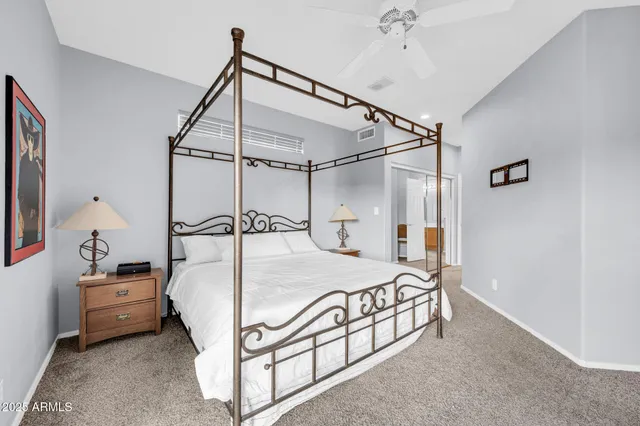 a kitchen with a sink a counter top space stainless steel appliances and a window