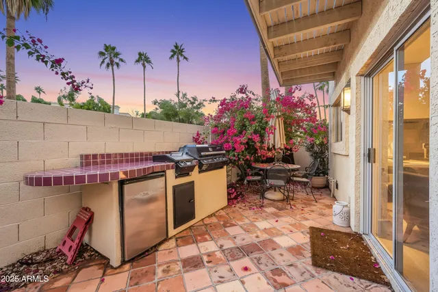 an aerial view of a house with swimming pool and lounge chairs