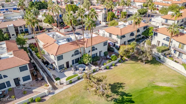 an aerial view of residential house with outdoor space and swimming pool