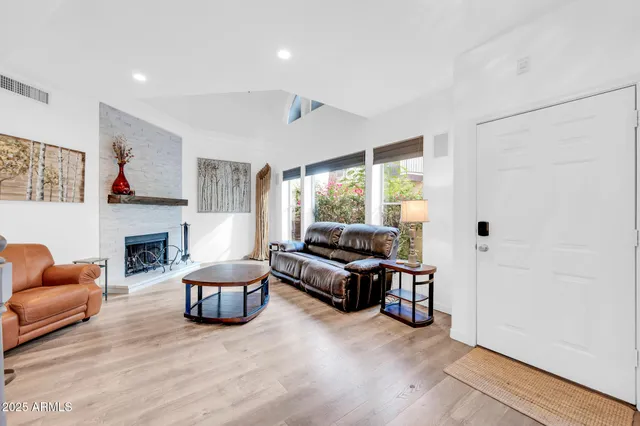 a backyard of a house with plants and entryway