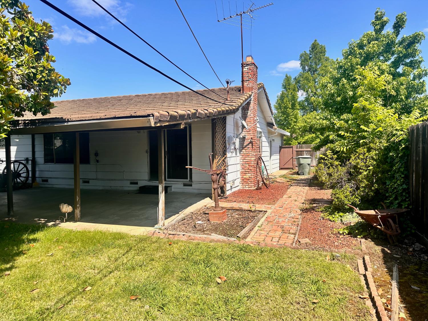 3207 Terry Way Carmichael, CA 95608 - Photo 33 of 36 a backyard of a house with yard and outdoor seating