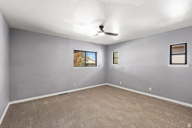 2576 Gramercy Avenue Ogden, UT 84401 - Photo 9 of 20 Empty room featuring carpet and ceiling fan