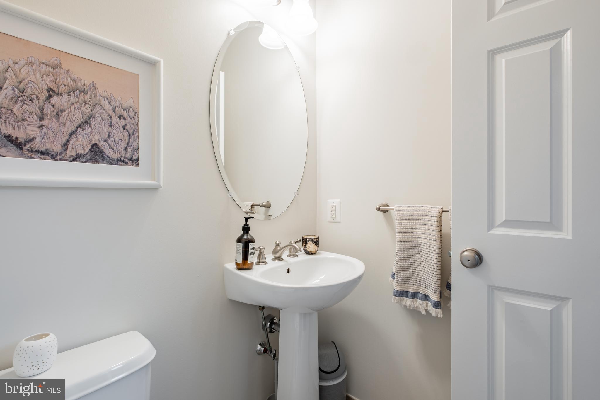 112 Commodore Court Philadelphia, PA 19146 - Photo 19 of 55 a bathroom with a sink mirror and toilet