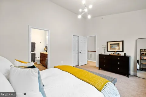 a bed room with a bed and a window