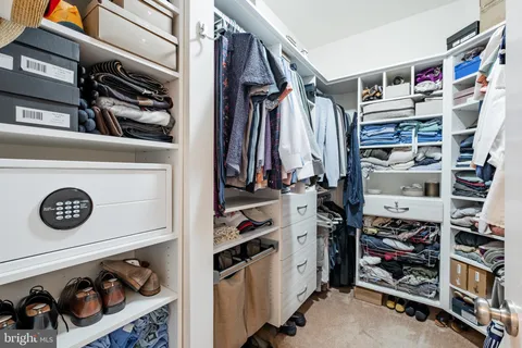 a bathroom with a granite countertop sink a toilet and a mirror