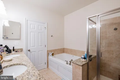 a bedroom with furniture and baby crib