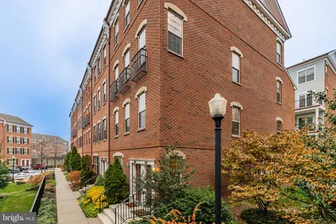a view of a house with potted plants