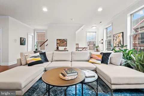a living room with furniture and a table