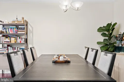 a living room with furniture and book shelf