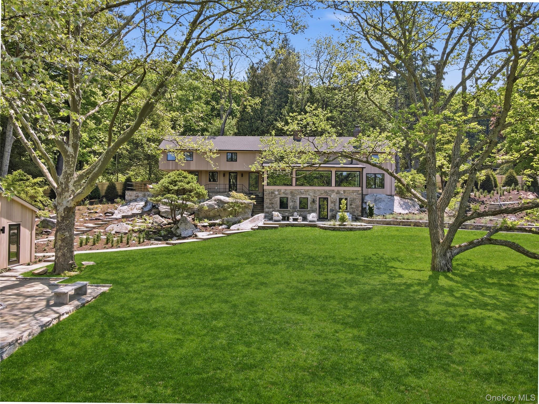 39 Old Snake Hill Road Pound Ridge, NY 10576 - Photo 2 of 37 a view of a house with a big yard