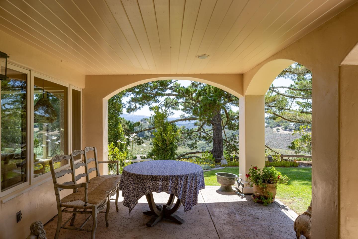 11502 Saddle Road Monterey, CA 93940 - Photo 25 of 40 a view of a patio with table and chairs and potted plants