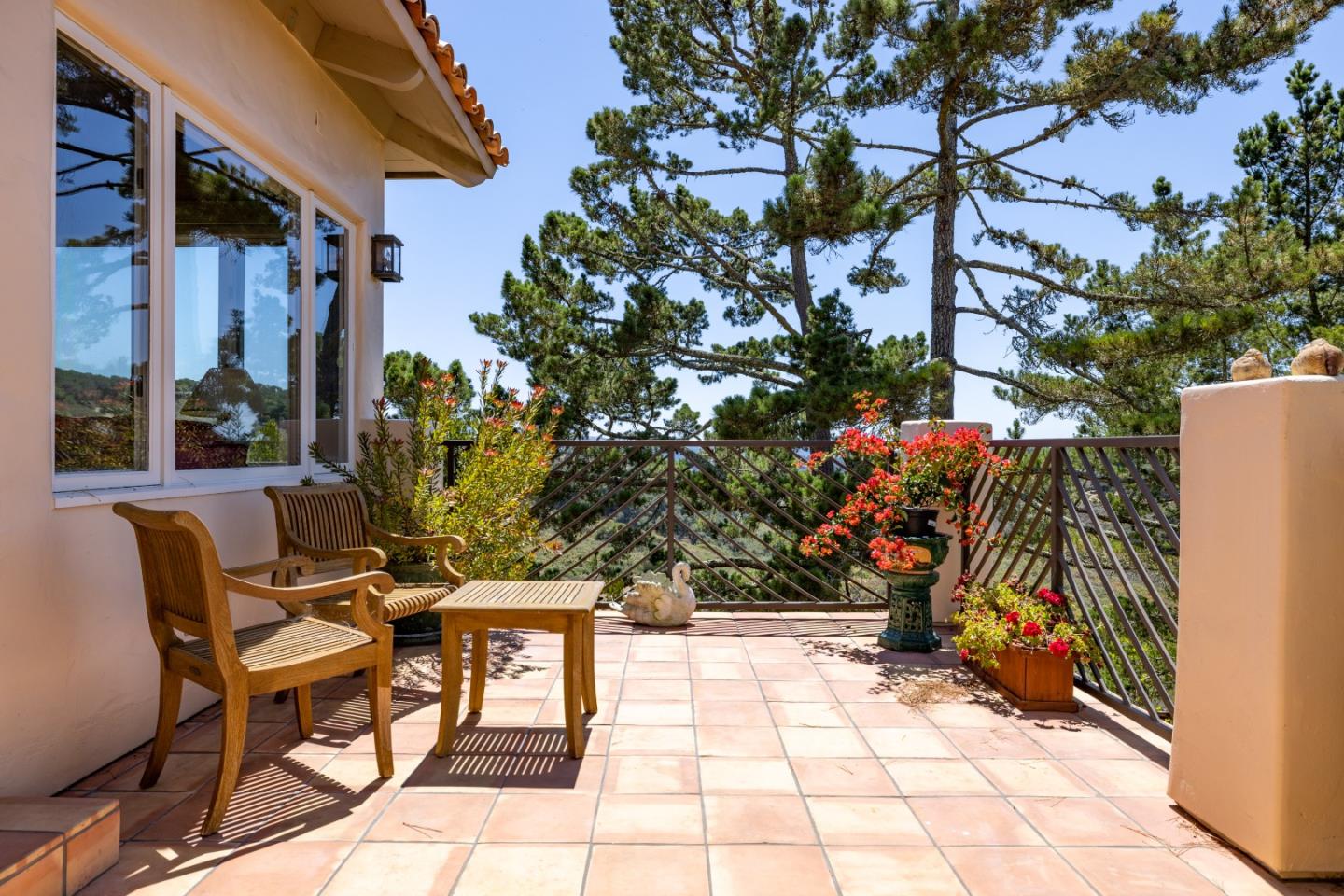 11502 Saddle Road Monterey, CA 93940 - Photo 26 of 40 a view of patio with table and chairs and potted plants