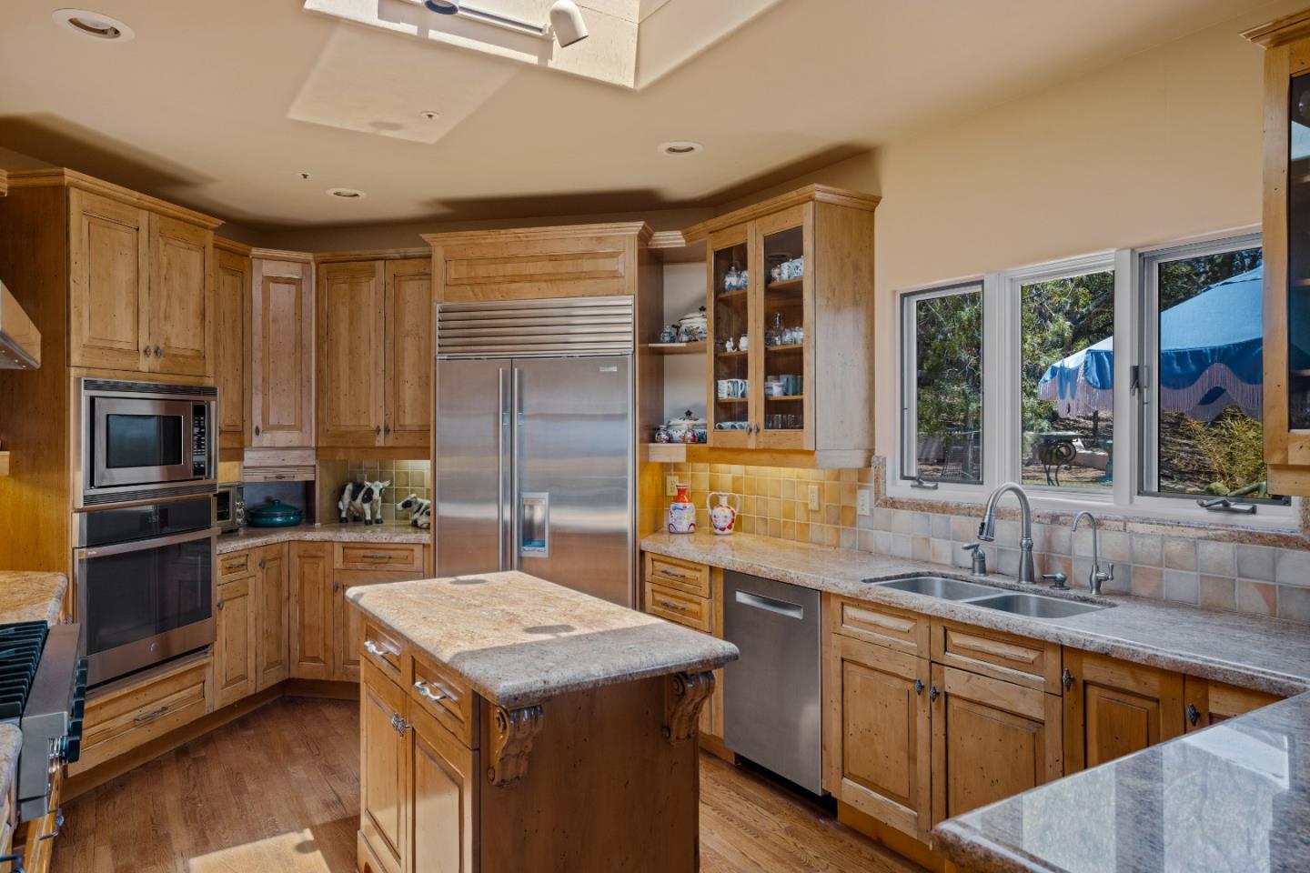11502 Saddle Road Monterey, CA 93940 - Photo 9 of 40 a kitchen with a stove sink and refrigerator