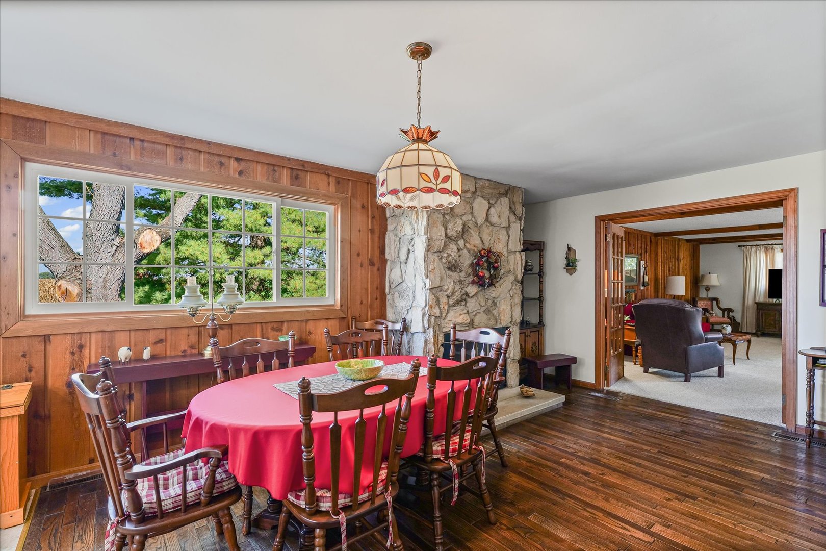 1106 South Spring Lake Road Mahomet, IL 61853 - Photo 21 of 36 a view of a dining room with furniture window and wooden floor