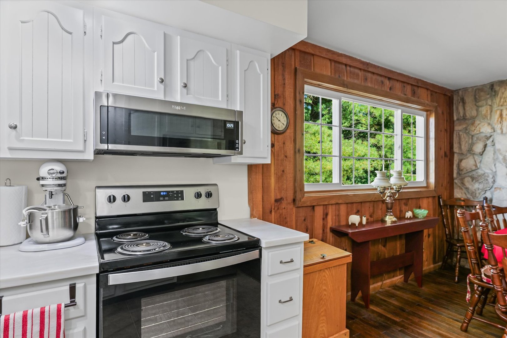1106 South Spring Lake Road Mahomet, IL 61853 - Photo 26 of 36 a kitchen with a stove and a microwave