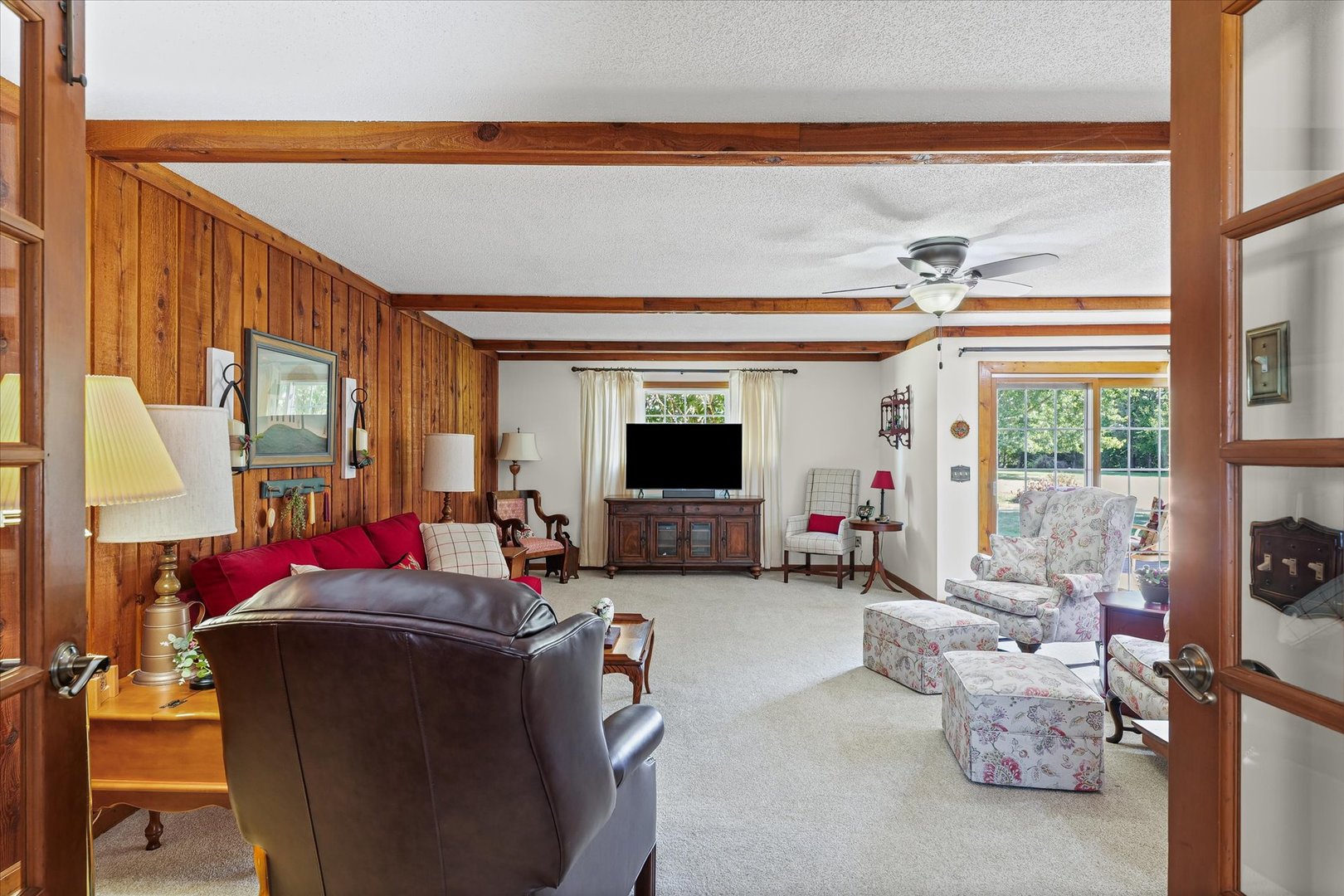 1106 South Spring Lake Road Mahomet, IL 61853 - Photo 27 of 36 a living room with furniture and a flat screen tv