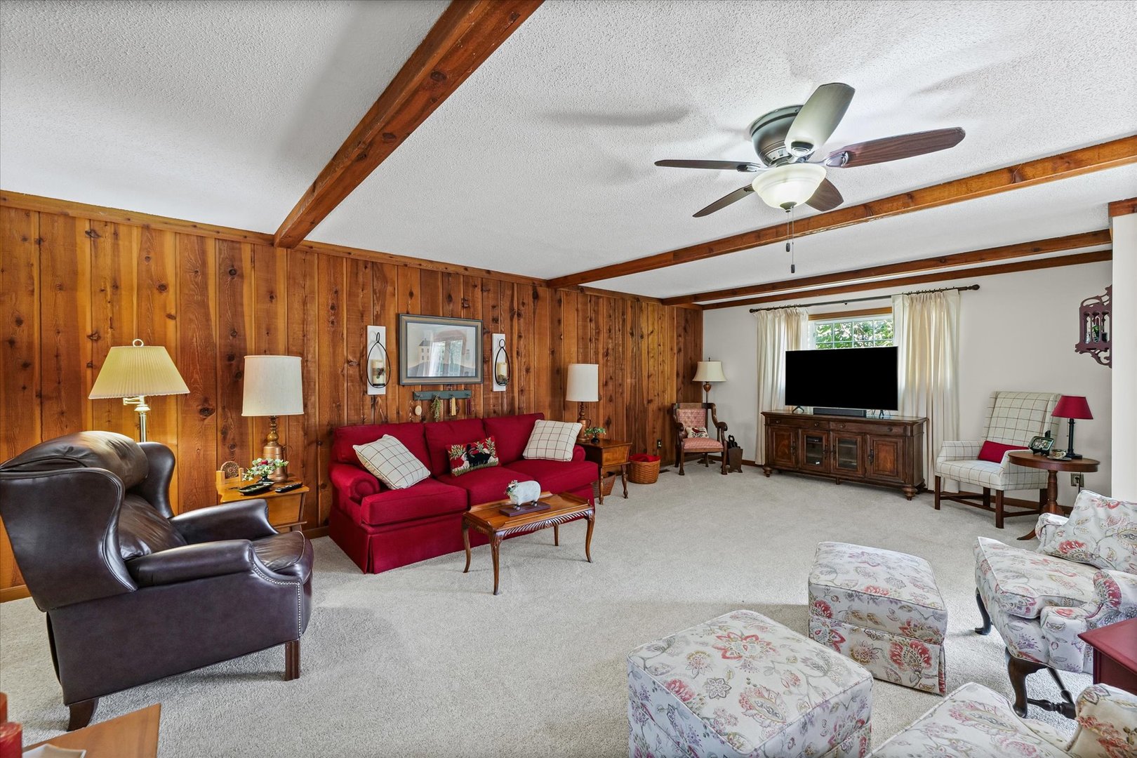1106 South Spring Lake Road Mahomet, IL 61853 - Photo 29 of 36 a living room with furniture and a flat screen tv