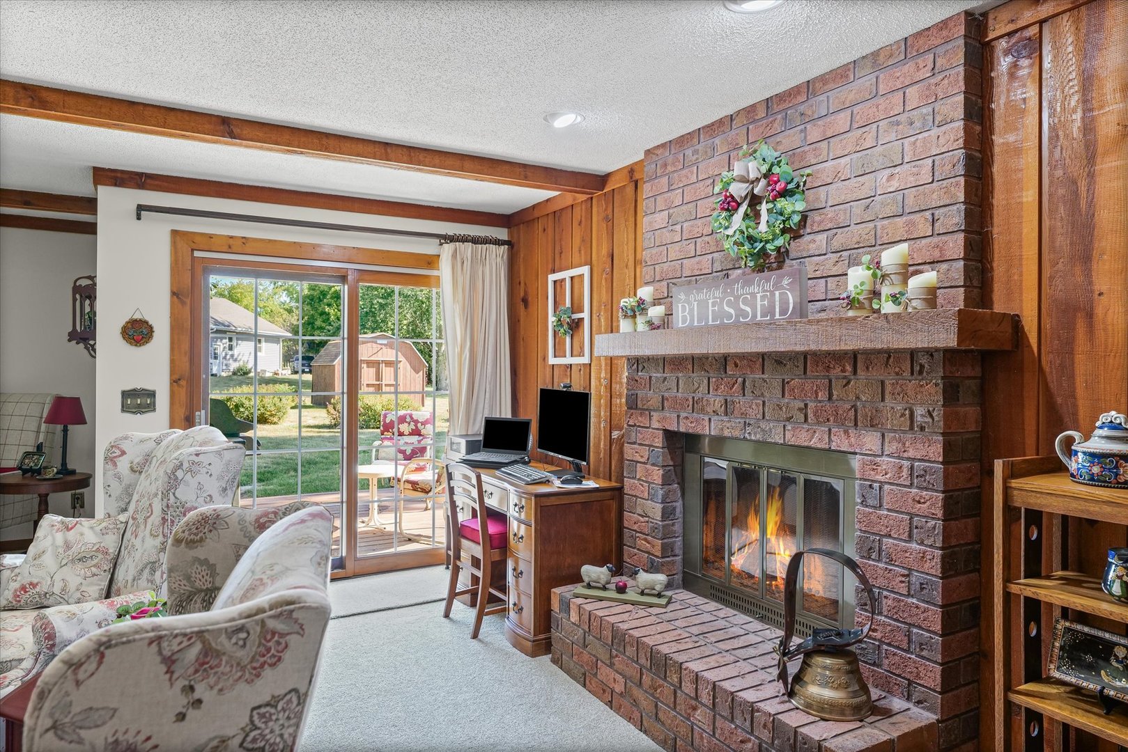 1106 South Spring Lake Road Mahomet, IL 61853 - Photo 30 of 36 a living room with furniture and a fireplace