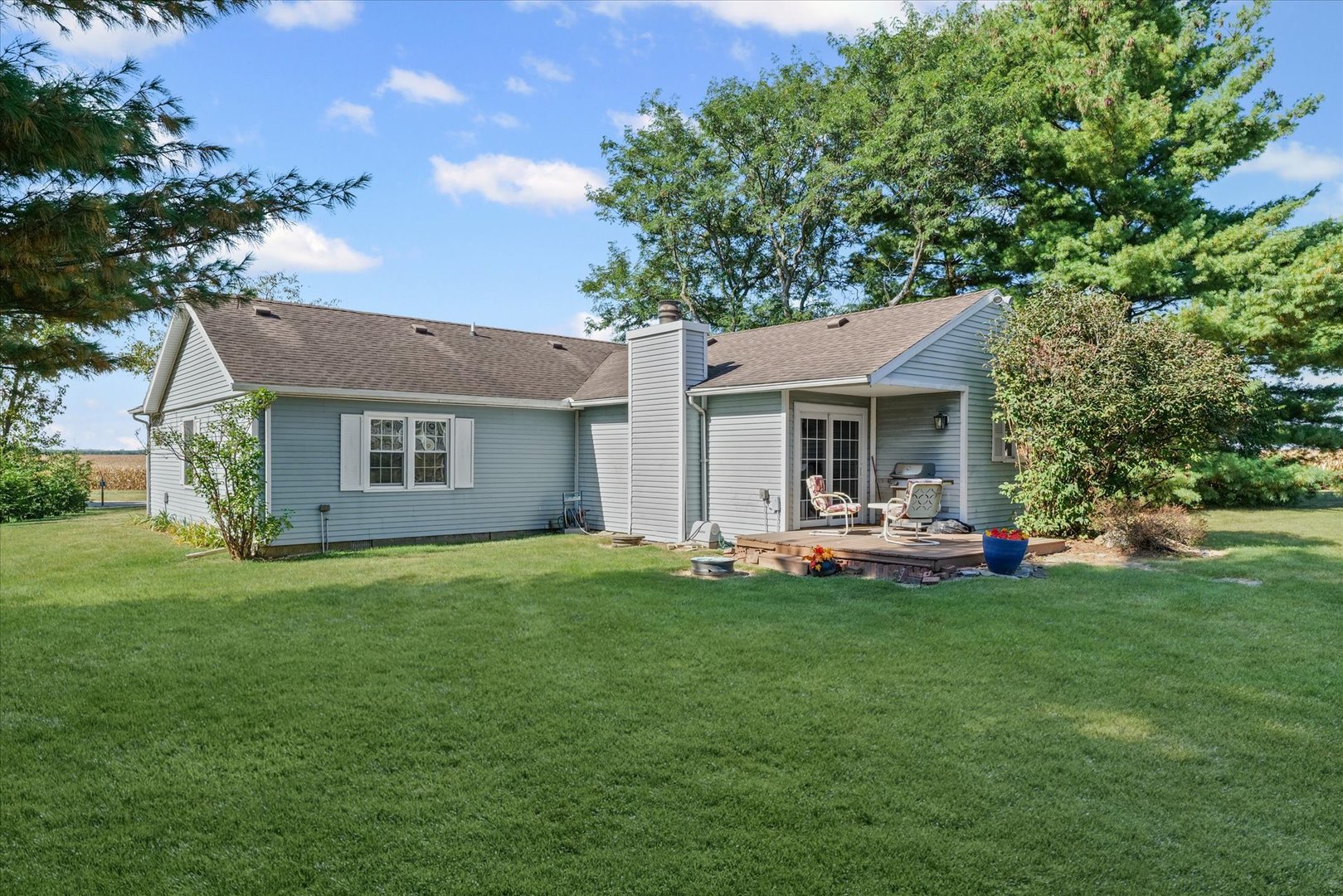 1106 South Spring Lake Road Mahomet, IL 61853 - Photo 32 of 36 a front view of a house with a garden and porch