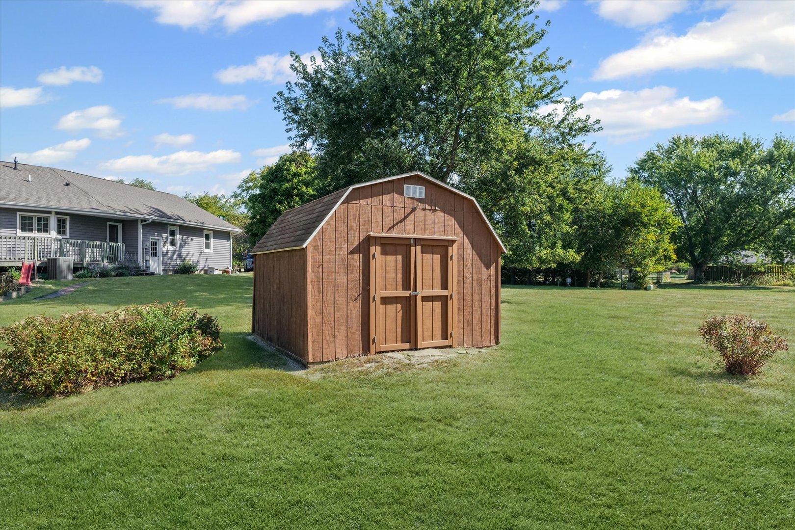 1106 South Spring Lake Road Mahomet, IL 61853 - Photo 34 of 36 a view of a garden with a large tree and a garden