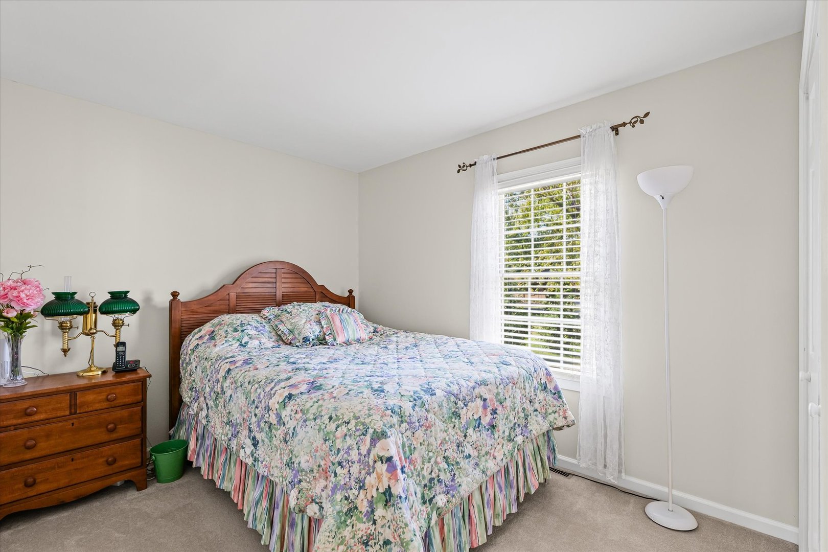 1106 South Spring Lake Road Mahomet, IL 61853 - Photo 10 of 36 a bedroom with a bed and a dresser