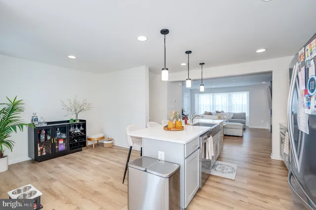 a large kitchen with sink and cabinets