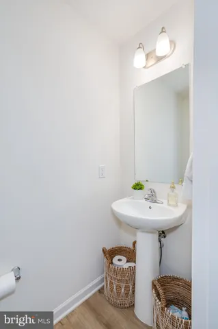 a bedroom with a bed and a potted plant