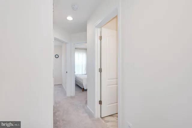 a view of walk in closet with clothes