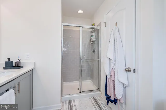 a living room with furniture and a wall painting