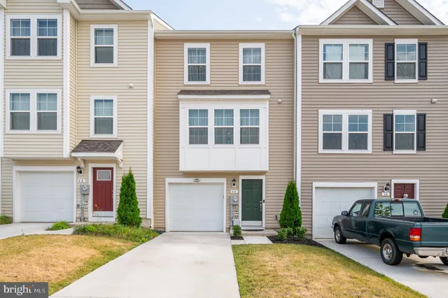 a car parked in front of a house