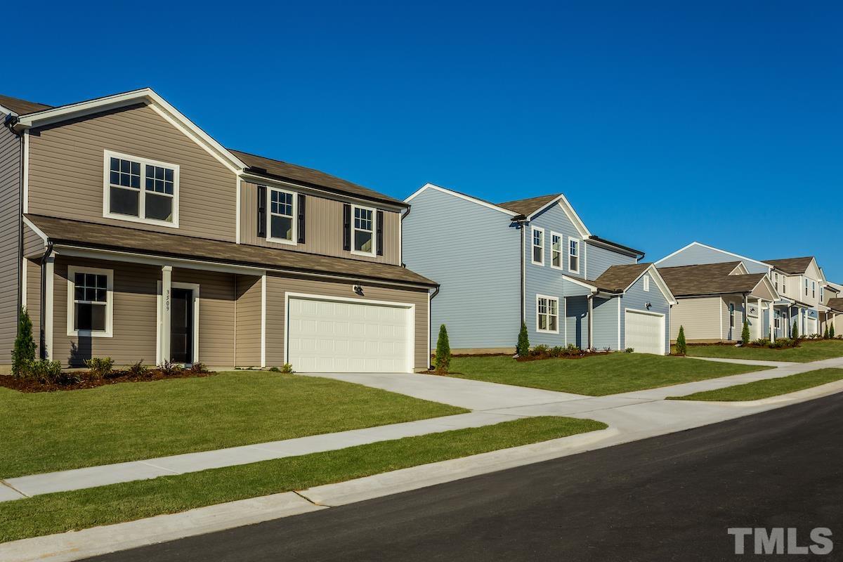 1636 Arapahoe Ridge Drive Raleigh, NC 27604 - Photo 5 of 13 a front view of a house with a yard